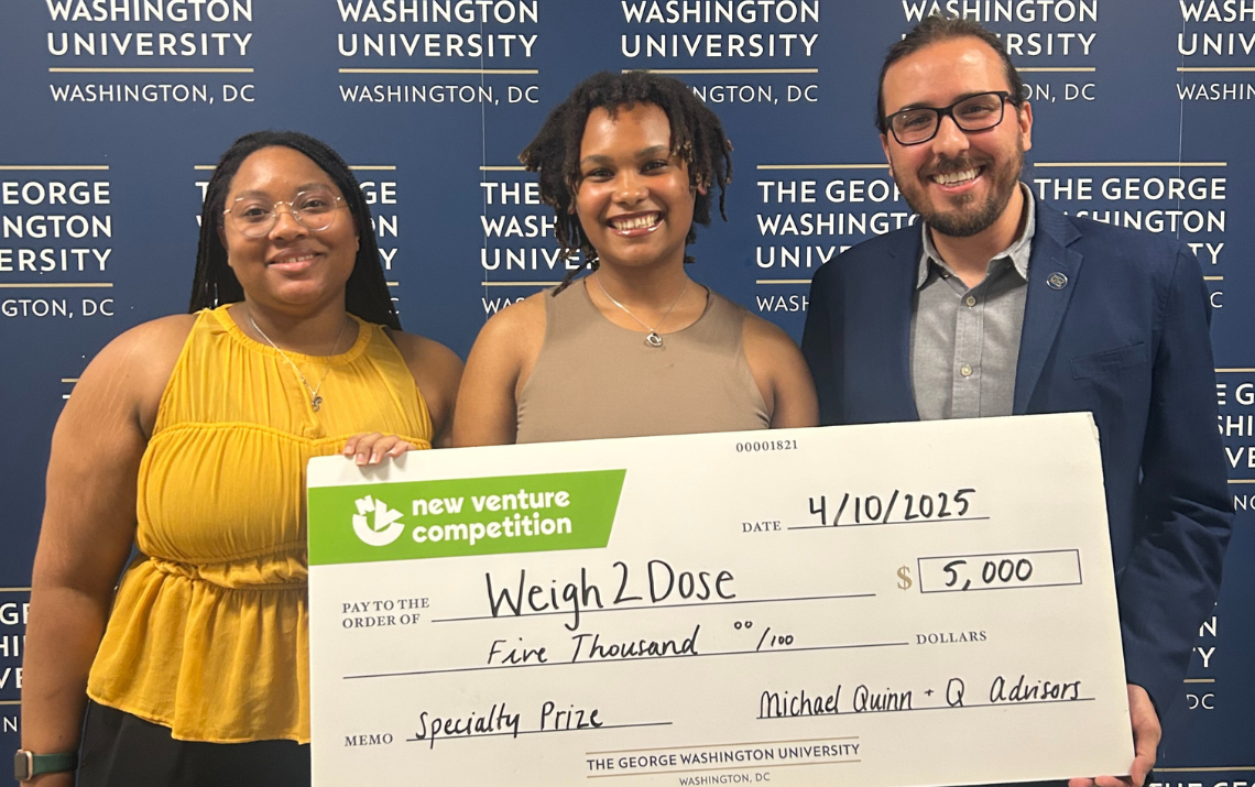 Paprika Berry, Jada Convington, and Pedro Gazzinelli holding a presentation check for an award of $5,000 for their innovative project, Weigh2Dose.
